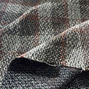 Karirani štof u toplim tonovima za jesenje i zimske kreacije.